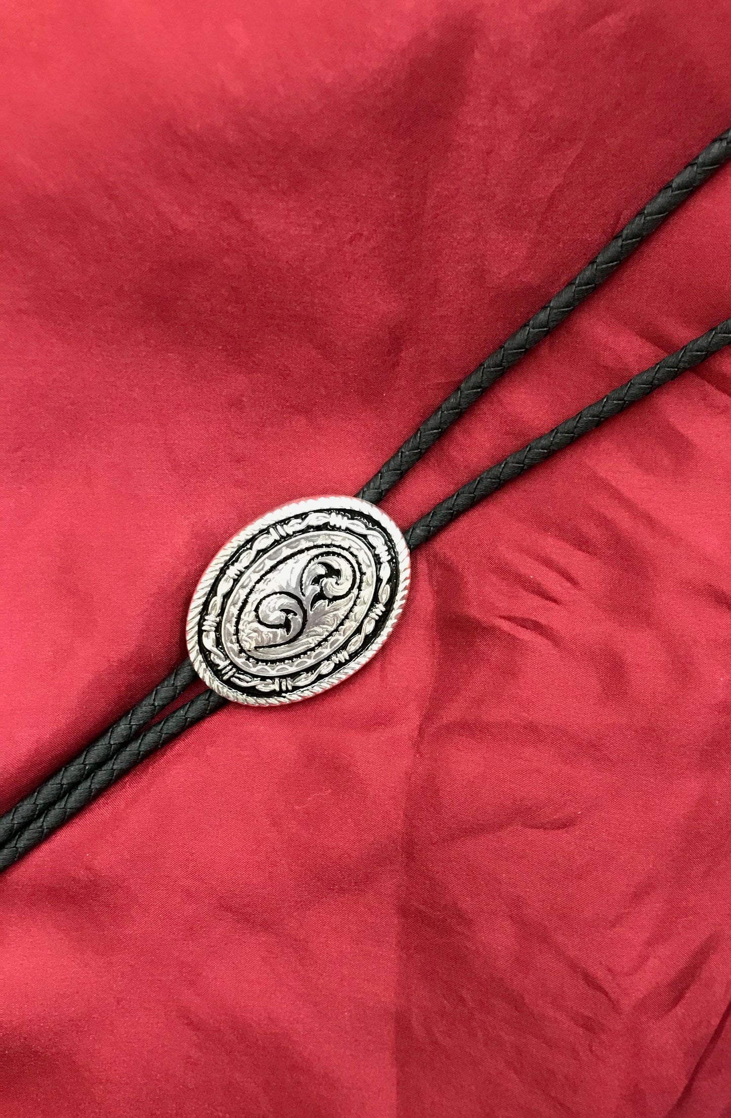 BLACK/SILVER BOLO TIE WITH BARBED WIRE TRIM